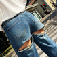 LM - Jeans Astor con strappi e strass posteriori 